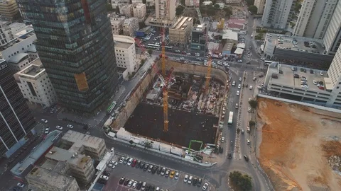 Aerial view over construction site at daytime. workers, engineers, cranes and Video stock 123651867