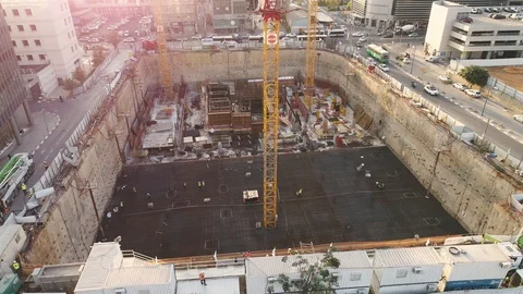 Aerial view over construction site at daytime. workers, engineers, cranes and Stock Footage 123651958