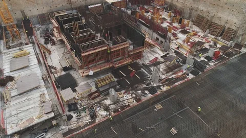 Aerial view over construction site at daytime. workers, engineers, cranes and Stock Footage 123652289