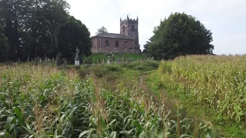Aerial view over country path to old country rural church Stock Footage 251641317