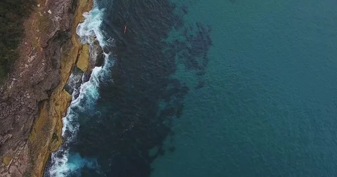 Aerial view over deep underwater rock reef blue ocean Stock Footage 70826024