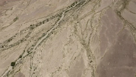 Aerial view over Desert Stream bed, Negev desert Stock Footage 130274307