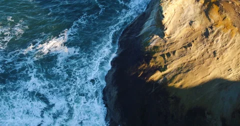 Aerial View Over Dramatic Ocean Waves Coastline with Amazing Sunrise Light Stock Footage