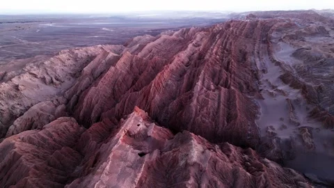 Aerial view over dramatic sharp ridges of eroded red rock formations in a vast Stockbeeldmateriaal 333176969
