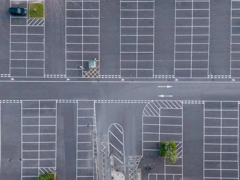 Aerial View Over Empty Car Parking Spaces Marked With White Lines And Asphalt Stock Photos