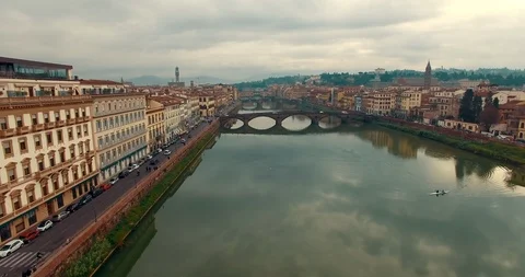 Aerial view over the Florence lying along the Arno river banks on a cloudy day Video stock 121785765