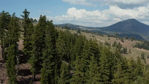 Aerial view over a forest and valley near Crater Lake National Park in Oregon Stock Footage 120575907