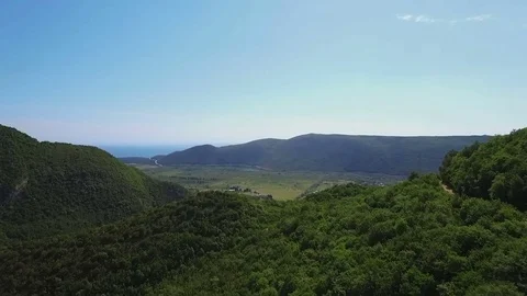Aerial view over the forest in the mountains Stock Footage 76506826
