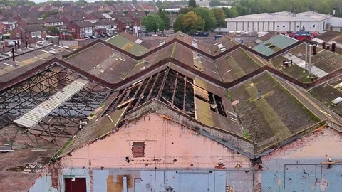 Aerial view over former Glen Dimplex site warehouse framework demolition Stock Footage 345405535