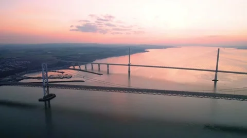 Aerial View Over Forth Road Bridge and Queensferry Crossing During Sunset Stock Footage 172549689