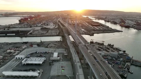 Aerial view over freeway, bridge and shipyard containers in Long Beach Stock Footage 171835406