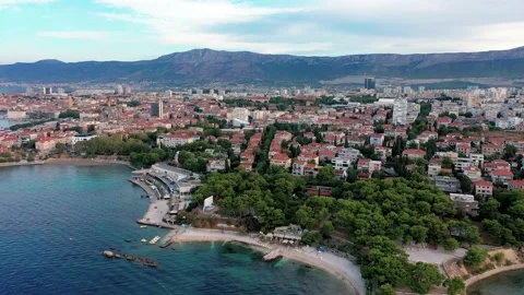 Aerial view over the  Grand Split city &amp; Bacvice Beach in summer morning Stock Footage 171829279