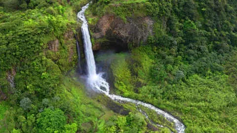 Aerial view over a high waterfall with the water evaporating at the bottom Stock Footage 155299444