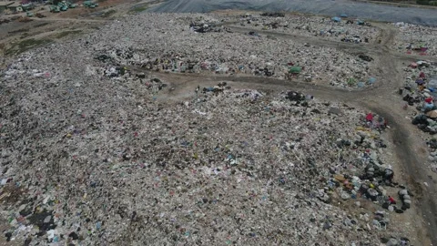 Aerial view over huge pile of garbage or waste waiting for recycle Stock Footage 154955341