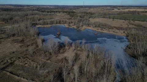 Aerial View Over Ice Covered Pond in Paris Ontario Canada (winter) Stock Footage 314202293