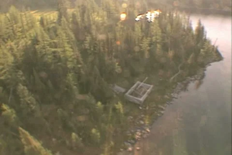 Aerial view over lake and forest Stock Footage