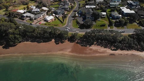 Aerial view over little Manly beach suburb in Whangaparoa Auckland Stock Footage 115217543