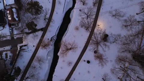 An aerial view over a long Island suburb, frozen in winter during a colorful Video stock 329220662