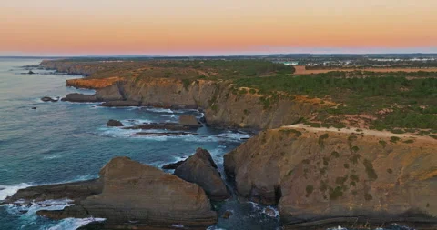 Aerial view over long rocky coastline in Portugal on sunset. Beautiful natural Video stock 312269088