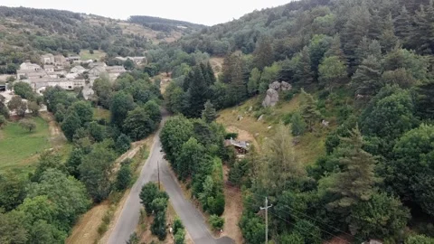 Aerial view over looking cabin in forest, HD Stock Footage 137012709
