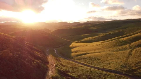 Aerial view over lush, green hills in California Stock Footage 103190855