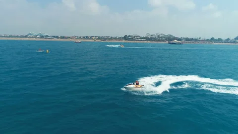 Aerial View Over Man Speeding On Jet Ski Tourist Attraction Stock Footage 111798433