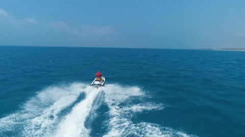 Aerial View Over Man Speeding On Jet Ski Tourist Attraction Stock Footage 111798619