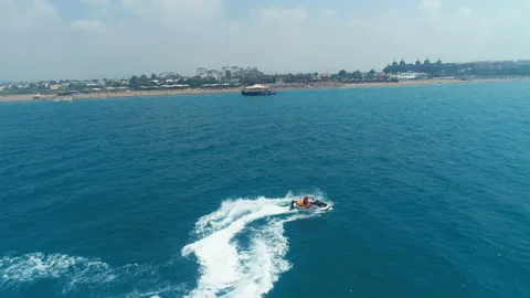 Aerial View Over Man Speeding On Jet Ski Tourist Attraction Stock Footage 111798895