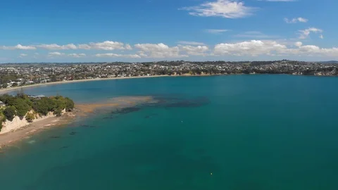 Aerial view over Manly beach suburb in Whangaparoa Auckland Stock Footage 115217656
