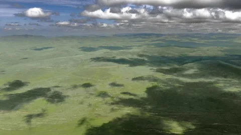 Aerial view over Mongolia steppe shows endless treeless plain - Untouched Land Stock Footage 339723718