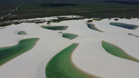 Aerial view over multiple lagoons and dunes in Lençóis Maranhenses, Brazil Video stock 328190231