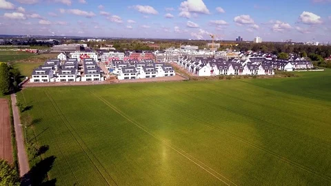 Aerial view over a new housing settlement  in a urban area. Video stock 75369727