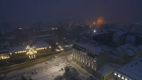 Aerial view over night Sofia with snowy roofs of architectural buildings 스톡 동영상 126977282