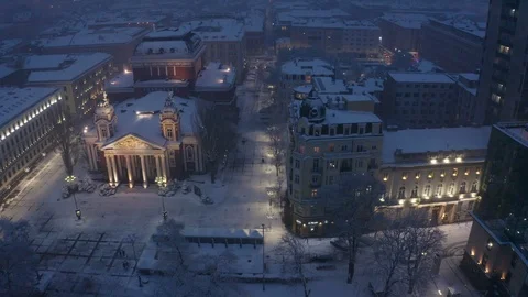 Aerial view over night Sofia architectural building and snow roofs 스톡 동영상 126977347