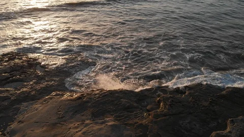 Aerial view over Ocean Beach at Sunset Stock Footage 88543992