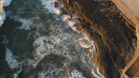 Aerial view over Ocean Beach at Sunset Stock Footage 88544143