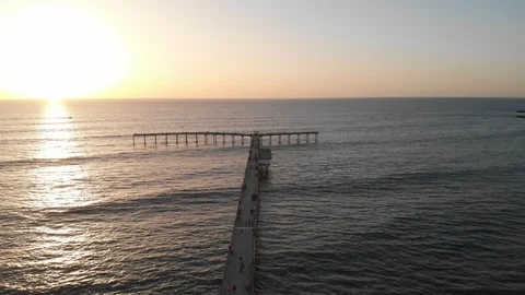 Aerial view over Ocean Beach at Sunset Stock Footage 88544309