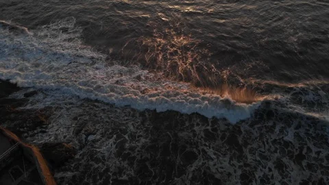 Aerial view over Ocean Beach at Sunset Stock Footage 88544510