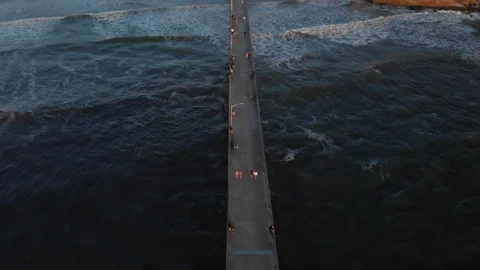 Aerial view over Ocean Beach at Sunset Stock Footage 88544591