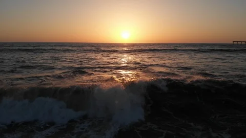 Aerial view over Ocean Beach at Sunset Stock Footage 88544977