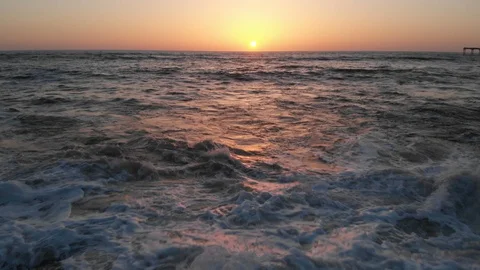 Aerial view over Ocean Beach at Sunset Stock Footage 88545178