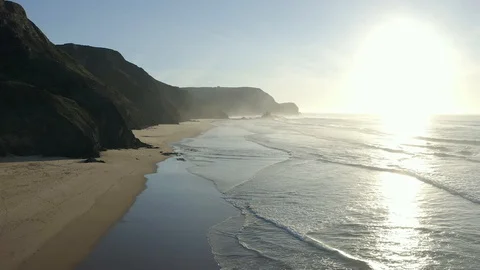 Aerial View Over Ocean Waves With A Cliff In The Fog Stock Footage 128844190