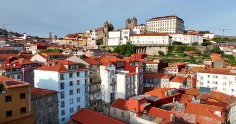 Aerial view over old tile red roofs of Porto city in Portugal. Main Cathedral Video stock 218474950