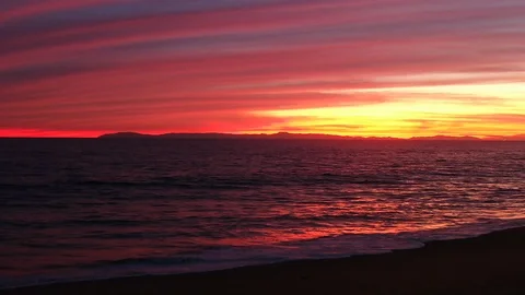 Aerial view over Pacific ocean coast horizon with twilight pink sky and water Stock Footage 122142029