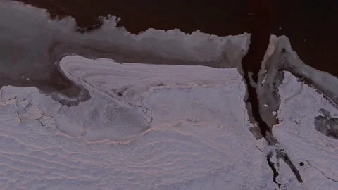 Aerial view over partialy frozen sea and small river delta 動画素材 149239072