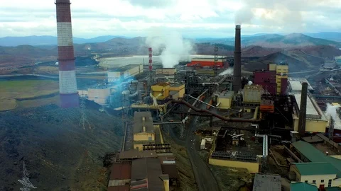 Aerial view over Pipes Throwing Smoke in Sky. Air Pollution From Industrial Stock Footage 118239041