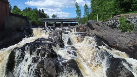 Aerial view over a powerful waterfall on a sunny day Stock-Footage 148030237