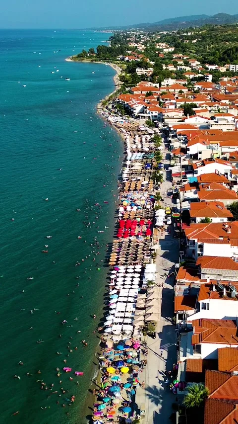 Aerial view over red roofs and sea of Polychrono, Greece Stock Footage 342238481