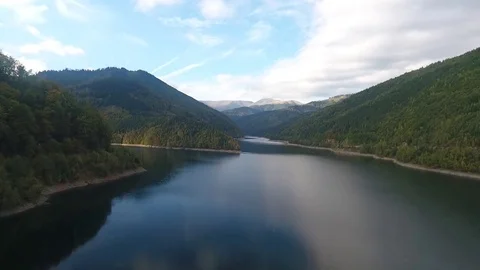 Aerial view over a river and mountains Stock Footage 71532091