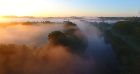 Aerial view over the river, forest in early morning fog 12 Stock Footage 108835432
